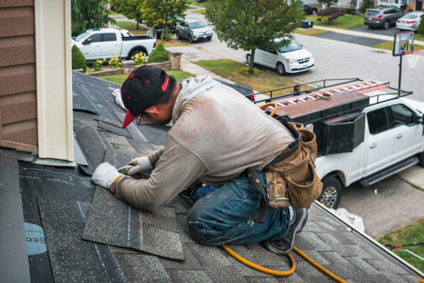Professional Roofing technician working in Center, ND